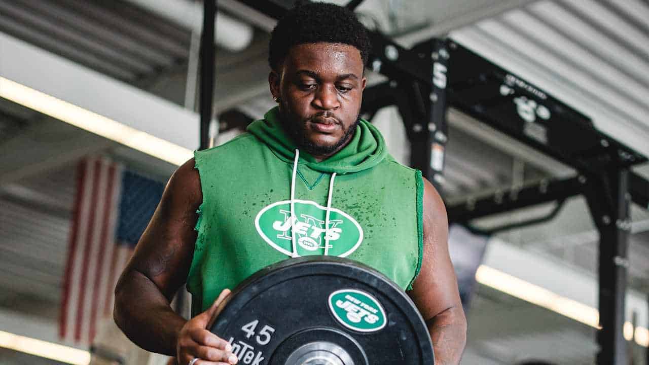 New York Jets right tackle Armand Membou trains during the offseason program.