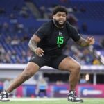 Anez Cooper participating in an offensive line drill at the NFL Combine.