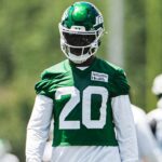 Breece Hall in a green New York Jets practice jersey during offseason work