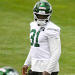 David Bailey stands on the field during New York Jets minicamp.