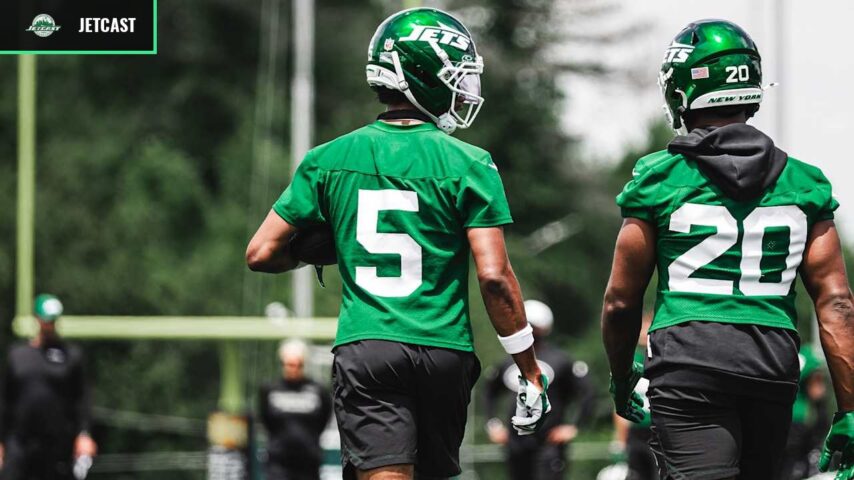 Garrett Wilson and Breece Hall walk together during New York Jets practice.