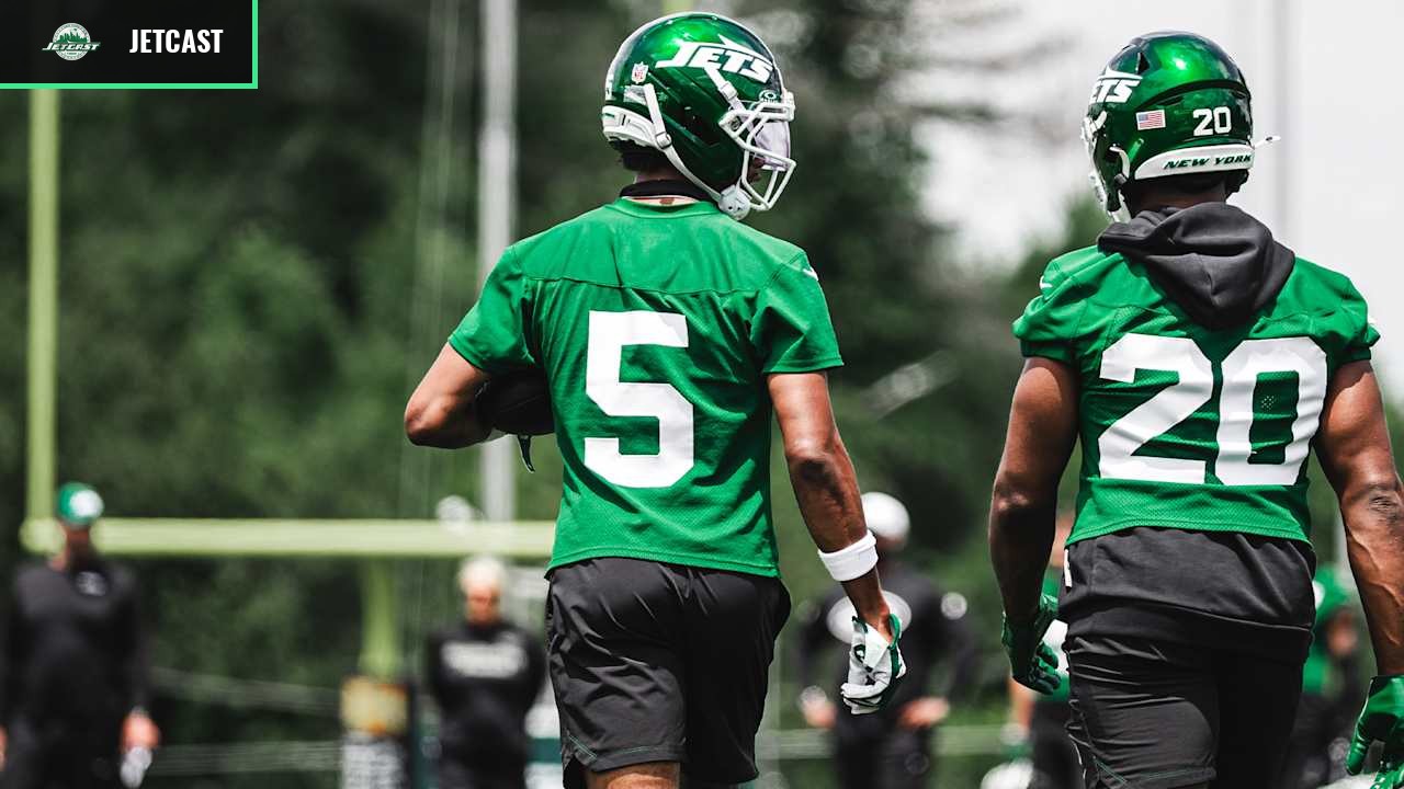 Garrett Wilson and Breece Hall walk together during New York Jets practice.