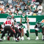 Jets quarterback Cade Klubnik, No. 10, lines up against the Buccaneers defense.