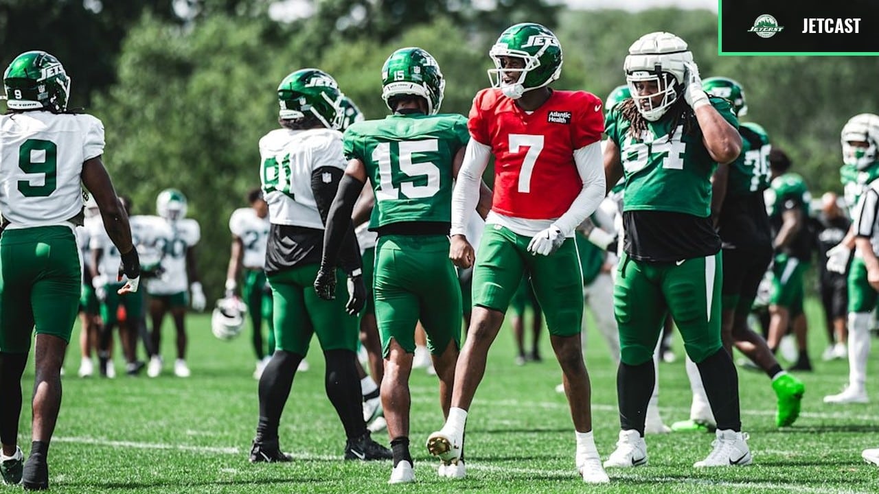 Geno Smith stands among New York Jets teammates during practice on August 24, 2026.
