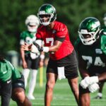 Geno Smith takes a snap during Jets training camp Day 3.