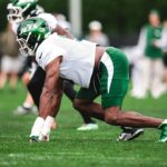 A Jets defender lines up during the first padded practice of 2026 training camp.